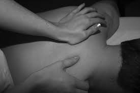 blog picture of man getting back massaged by female chiropractor