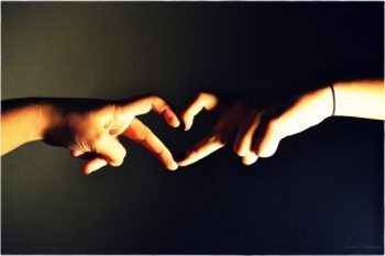 blog picture of a man and a woman's hand forming a heart