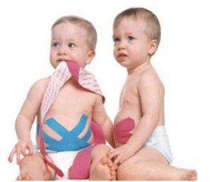 blog picture of two babies with kinesiology tape