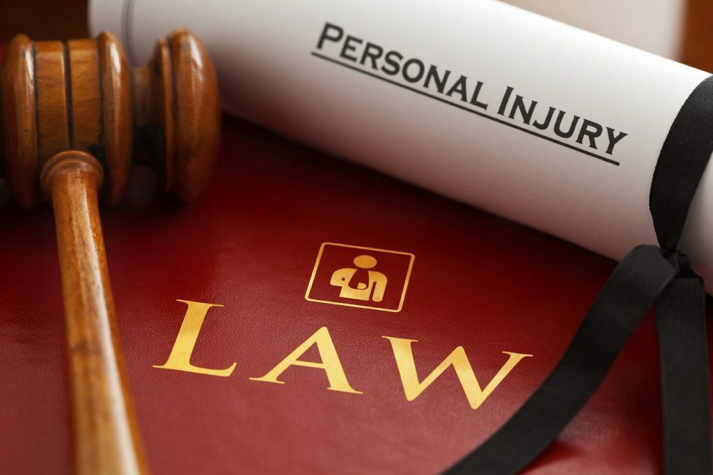 blog picture of gavel, law book, and scroll with the words personal injury