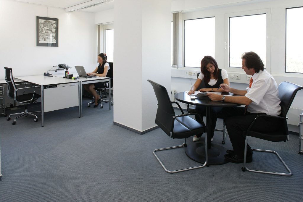 blog picture of office with three office workers