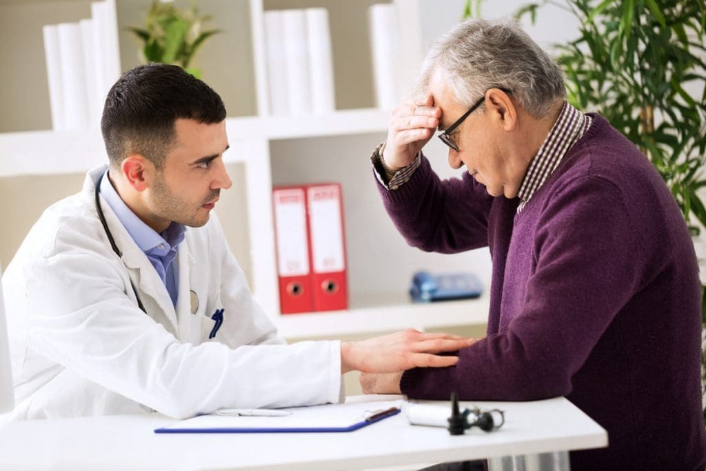 stock-photo-doctor-listening-to-patient-explaining-his-headache-painful-381901687-1024x683.jpg