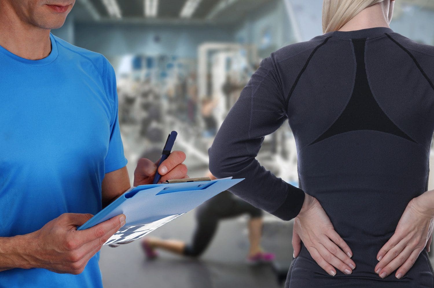 chiropractor takes notes on lady with back pain in gym