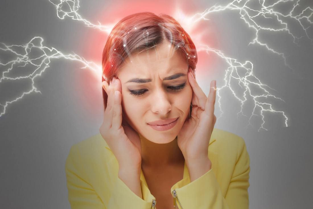 Image of a woman with a migraine demonstrated by lightning coming out of her head.