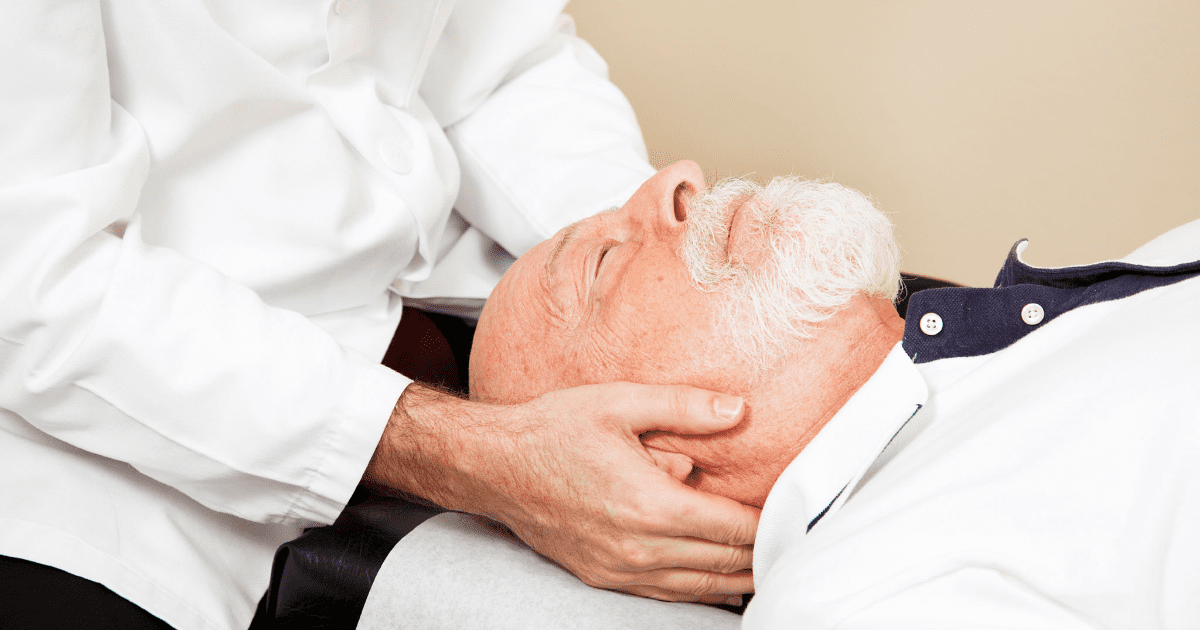 Image of an older man receiving chiropractic care for migraine relief.