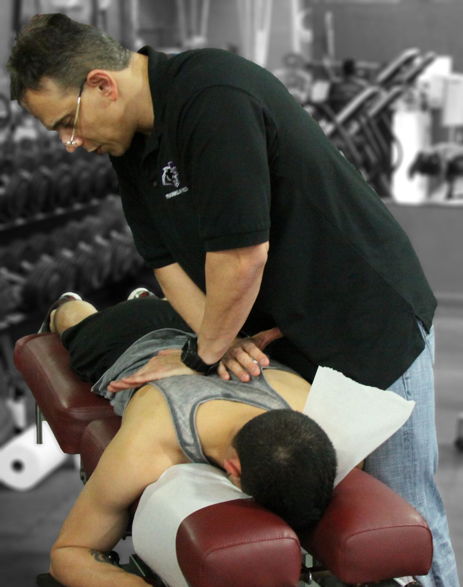 Dr Jimenez works on back treatment at Push crossfit competition | El Paso, TX Chiropractor
