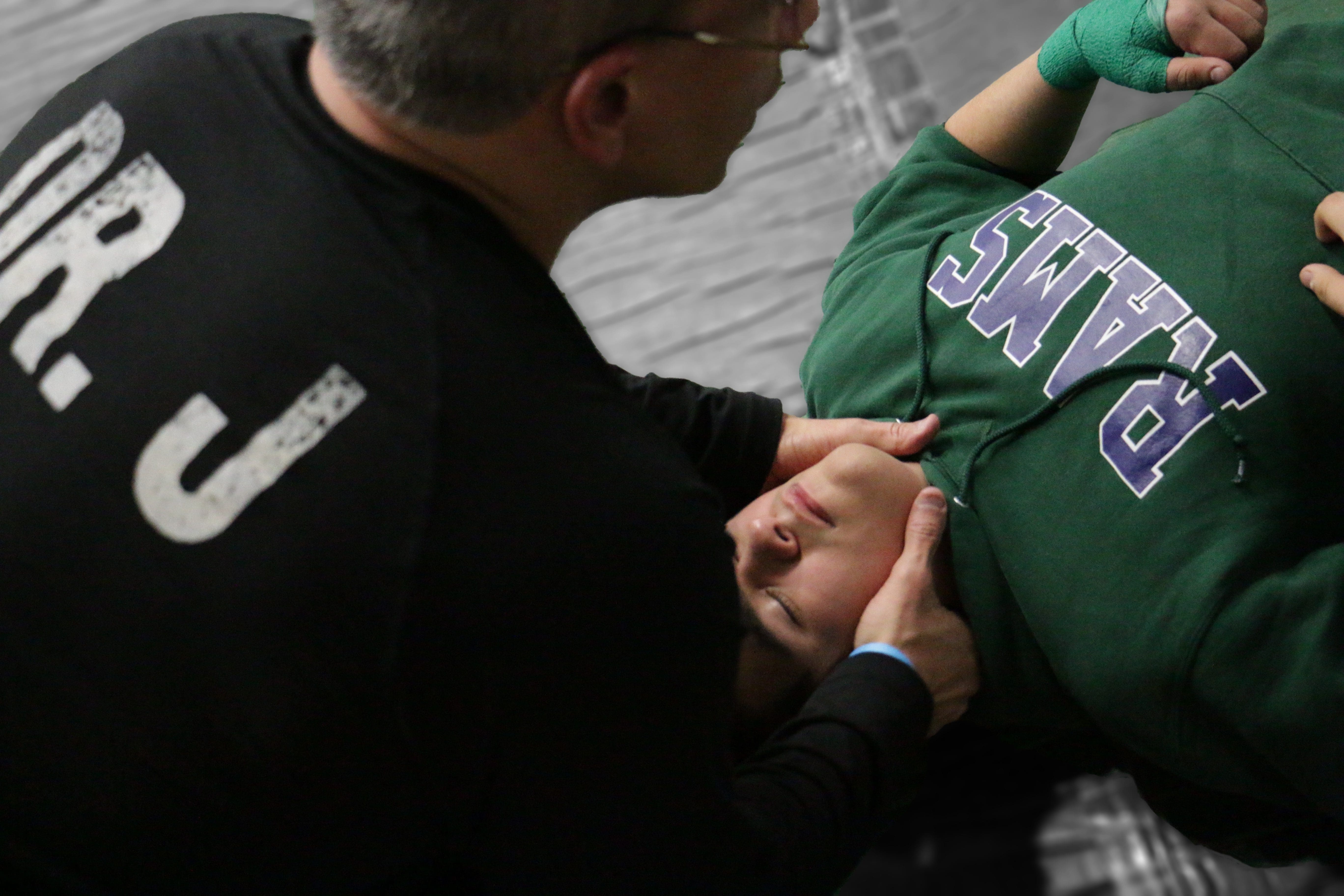 Dr Jimenez works on wrestler's neck