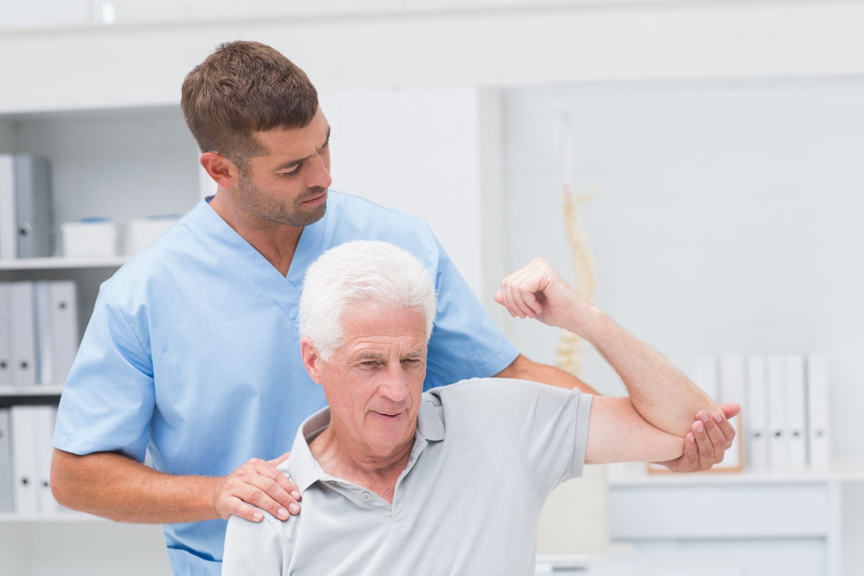 Image of an older man receiving physical therapy for migraine | El Paso, TX Chiropractor