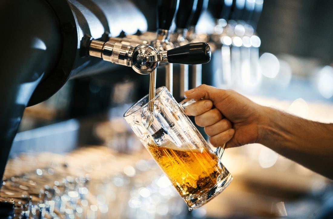 a-pint-of-beer-being-poured-which-may-cause-bloating